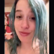 A cute girl with green dyed hair records herself shitting while squatting over a toilet. Decent between the legs perspective with some pissing. Over half a minute.